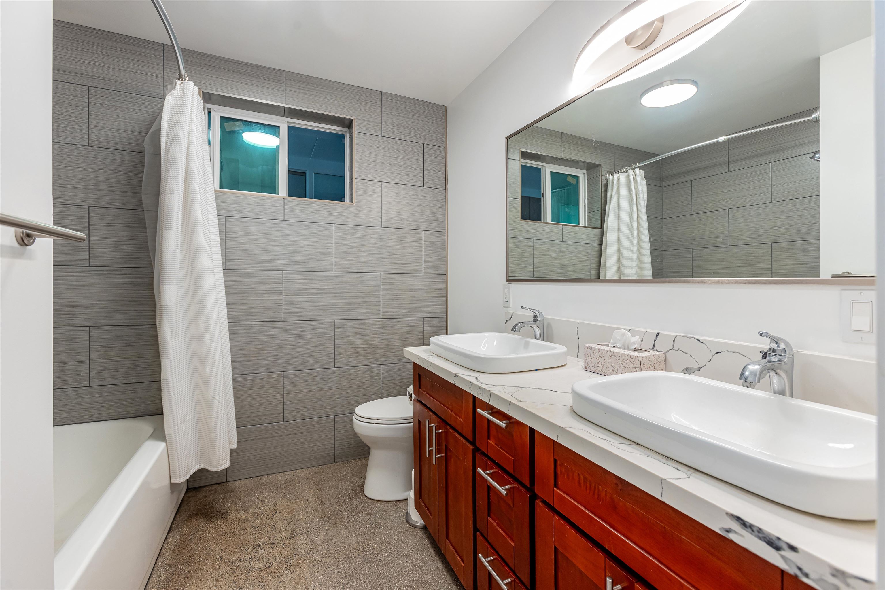 720 Mopua Street Haiku, HI 96708 - Photo 14 of 20 a bathroom with a sink and a mirror