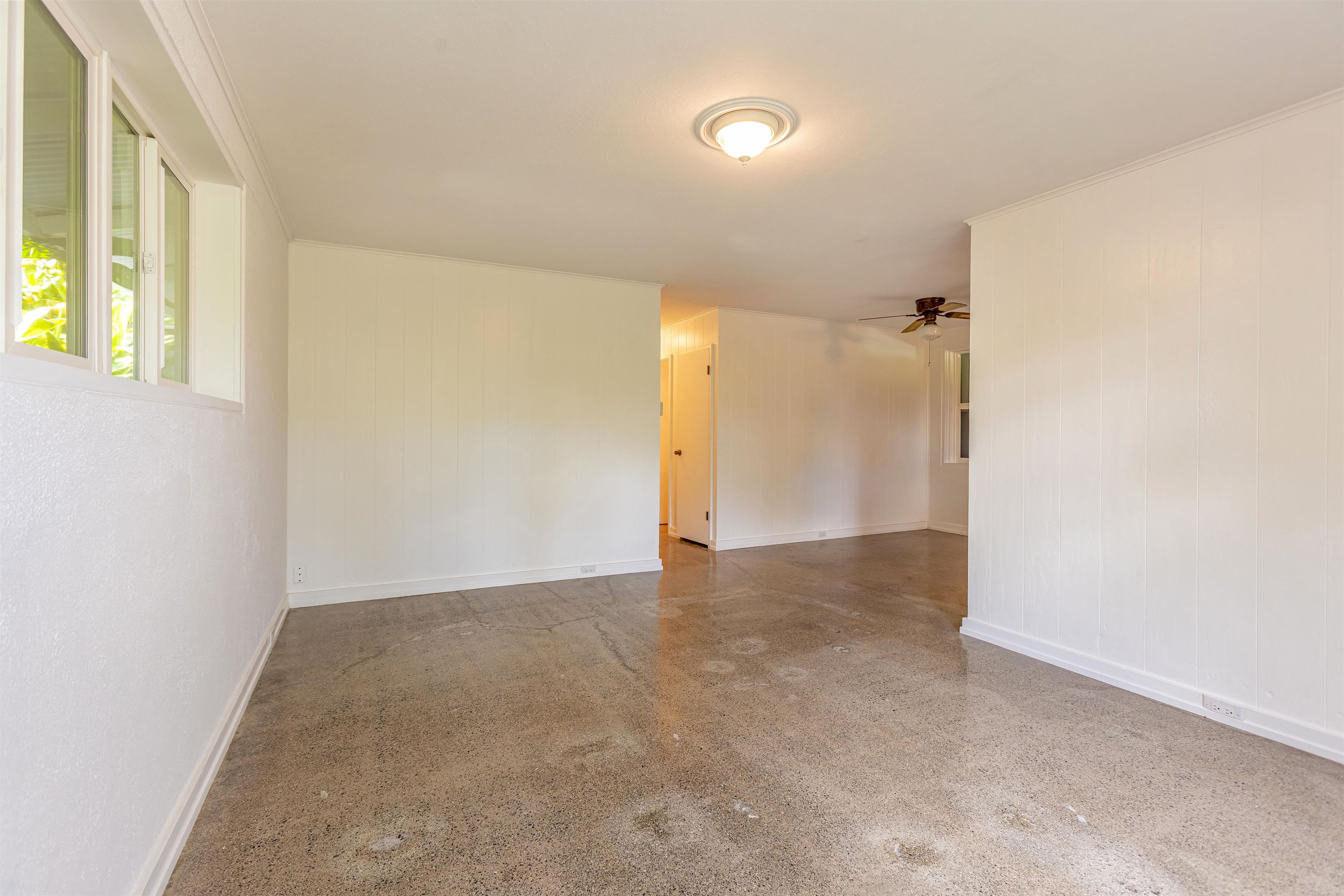 720 Mopua Street Haiku, HI 96708 - Photo 6 of 20 a view of an empty room with a window