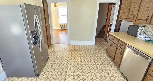 a bathroom with a sink a toilet a mirror and shower