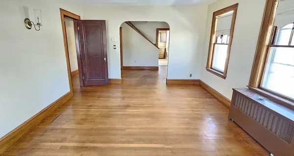a view of an entryway with wooden floor