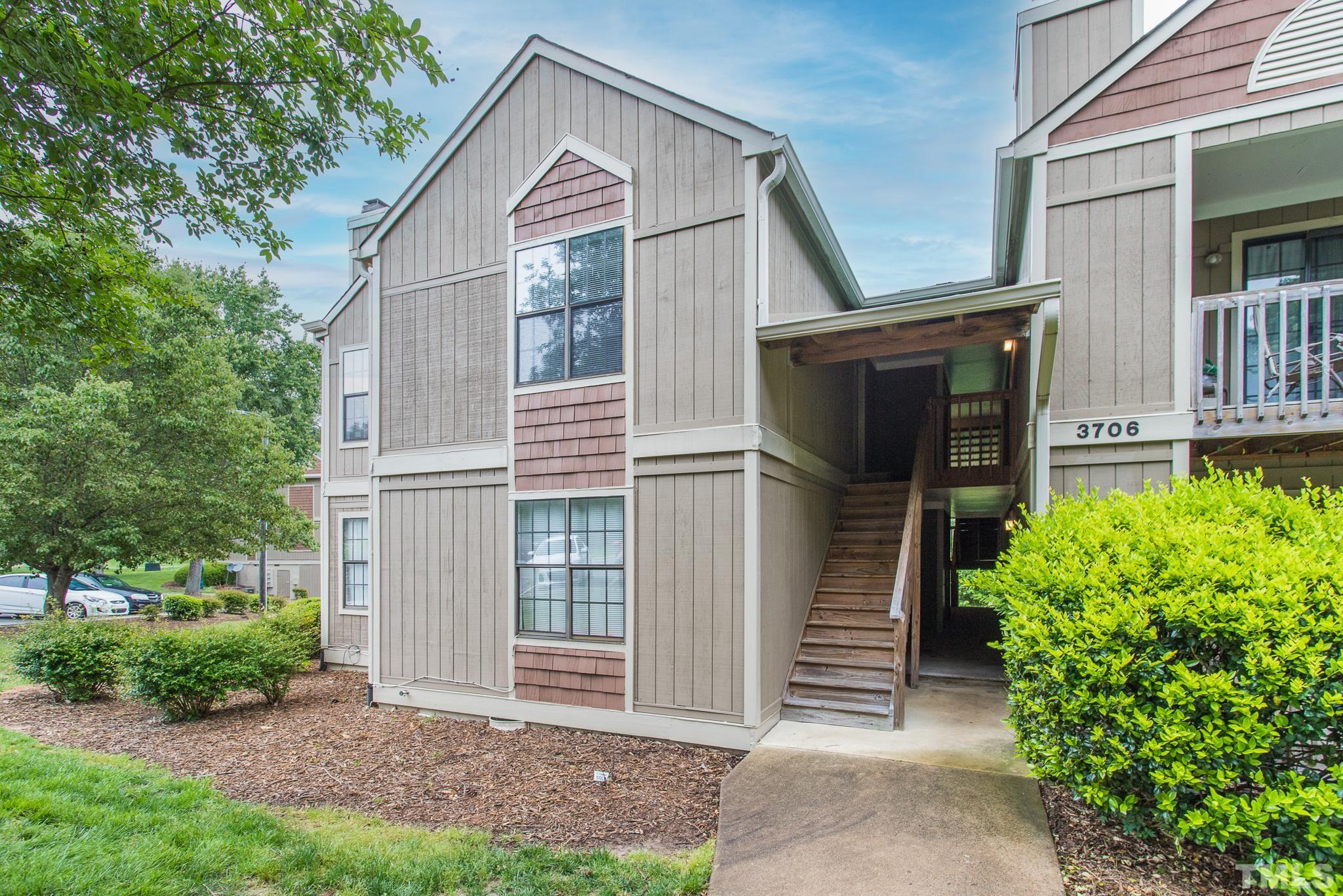 3706 Chimney Ridge Place, Unit 205 Durham, NC 27713 - Photo 1 of 18 a view of house with backyard and garden