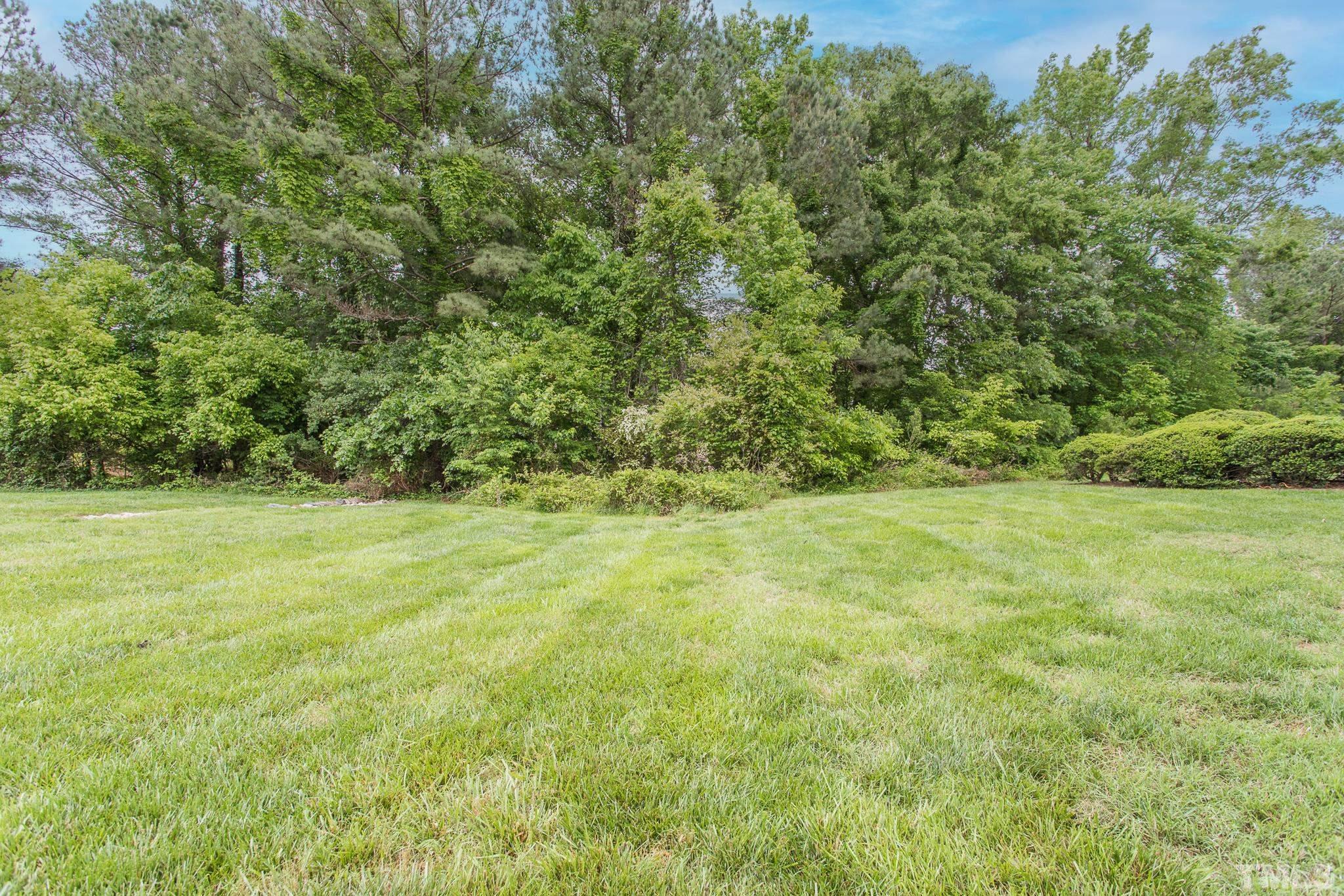 3706 Chimney Ridge Place, Unit 205 Durham, NC 27713 - Photo 5 of 18 a view of outdoor space with deck and yard