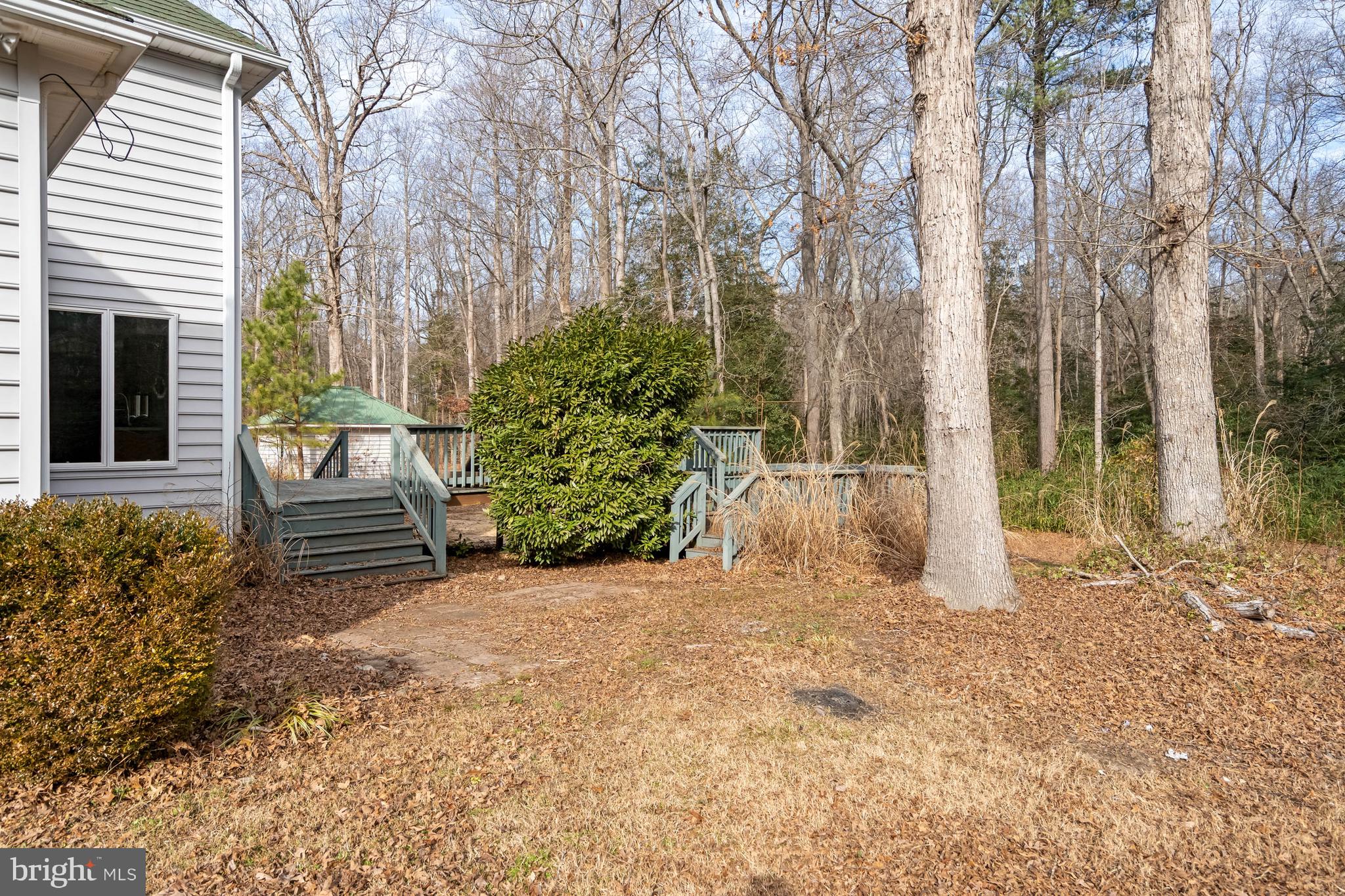 18885 Sand Hill Road Milton, DE 19968 - Photo 34 of 46 a view of a bench in the backyard of house