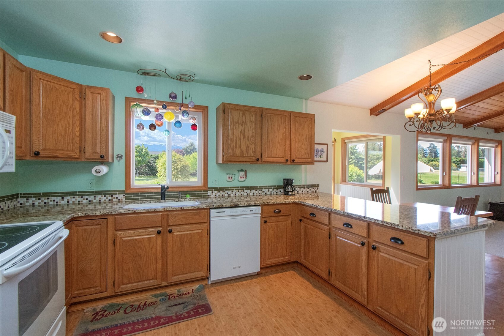 101 Timothy Lane Sequim, WA 98382 - Photo 10 of 39 a kitchen with lots of counter top space and sink