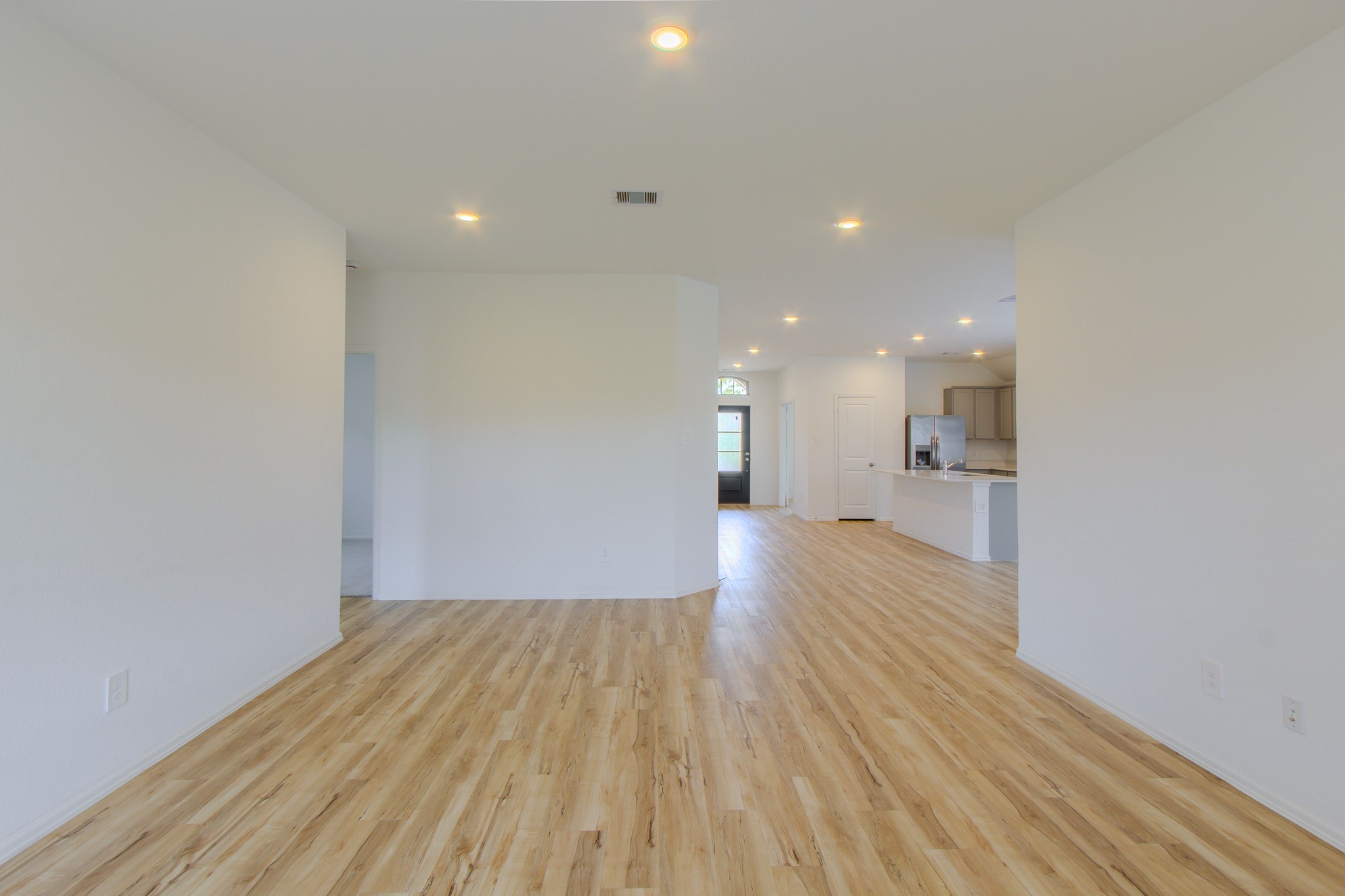 3113 Catalonion Court Conroe, TX 77301 - Photo 19 of 45 a view of empty room with wooden floor