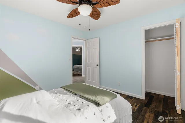 a bedroom with a bed and chandelier