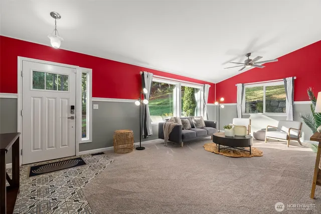 a living room with furniture and a large window