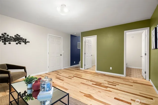 a bathroom with a sink a large mirror and a toilet