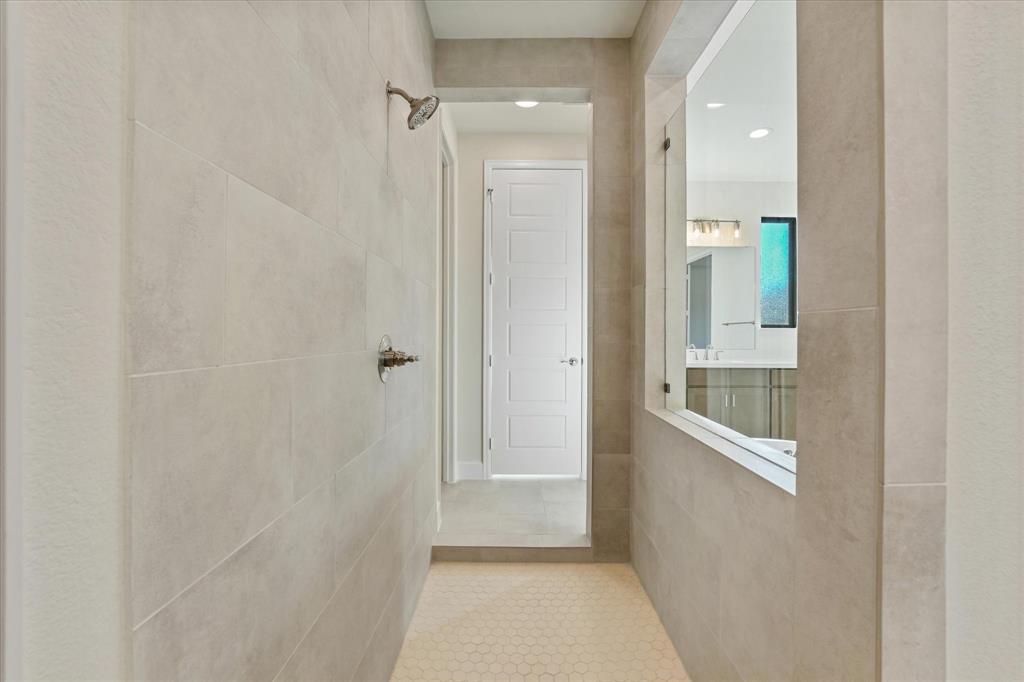 4626 Rillstone Road Midlothian, TX 76065 - Photo 18 of 40 Hallway featuring tile patterned flooring, recessed lighting, and tile walls