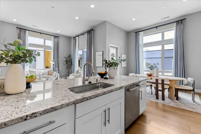 a kitchen with stove and cabinets