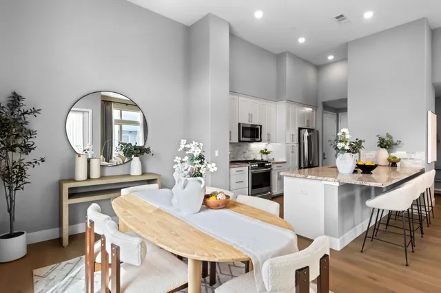 a dining room with furniture and window