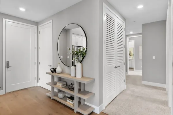 a spacious bedroom with a bed and a couch