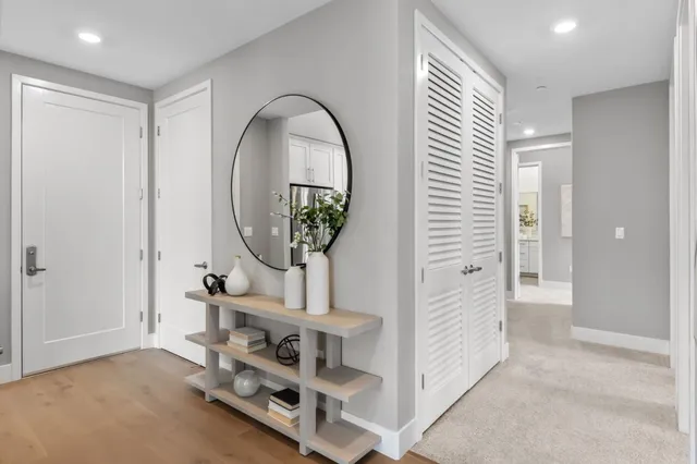 a spacious bedroom with a bed and a couch