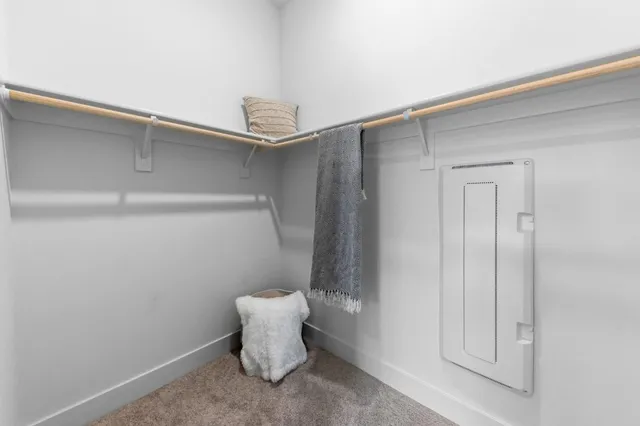 a bedroom with a bed and a mirror