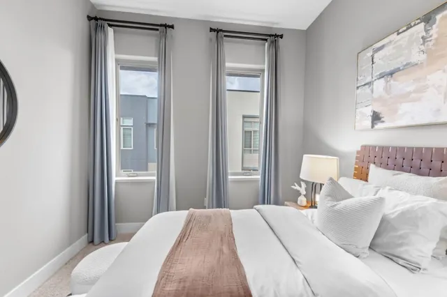 a view of a chair and table in front of house