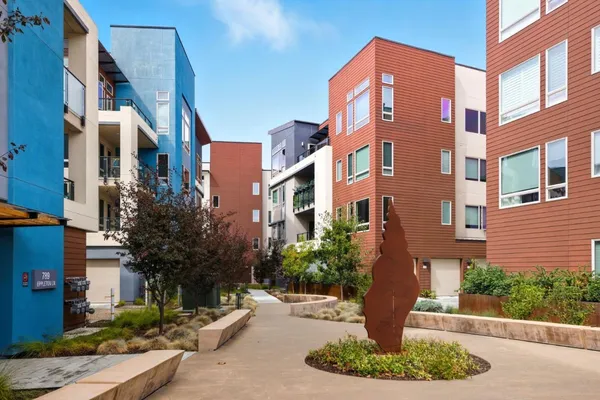 an aerial view of a residential apartment building with a parking space