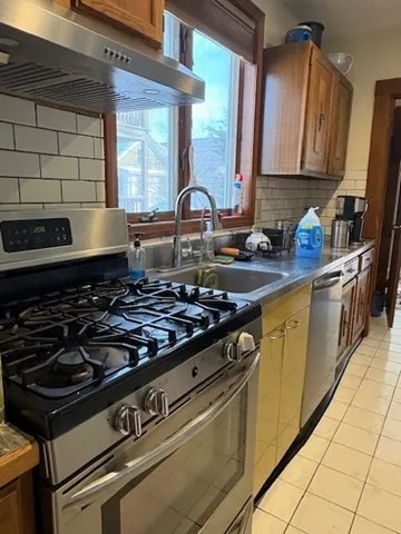 a kitchen with a stove and a sink