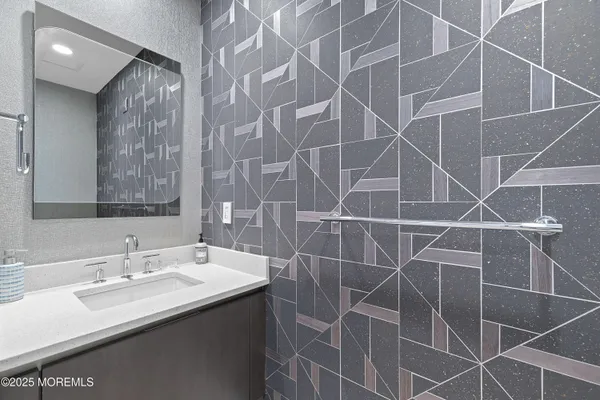 a bathroom with a sink and mirror