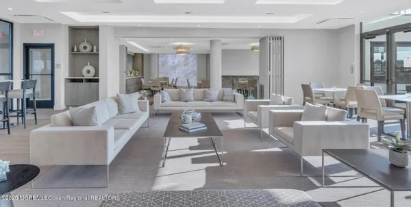 a living room with couches and a potted plant on coffee table