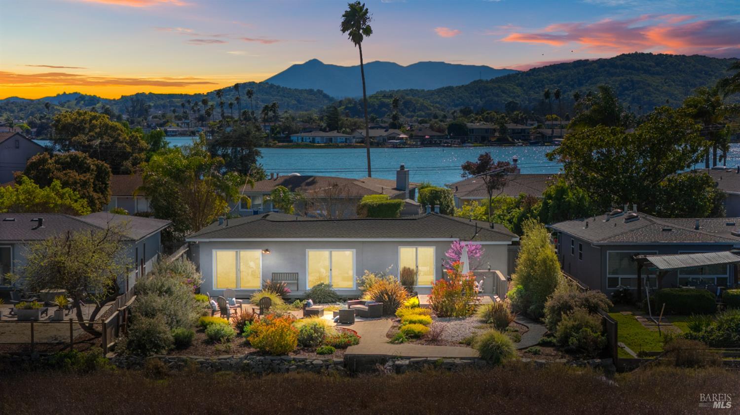 an aerial view of a house with yard swimming pool and outdoor seating