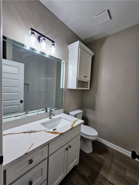 507 West Ragland Avenue Kingsville, TX 78363 - Photo 14 of 17 a bathroom with a toilet sink and mirror