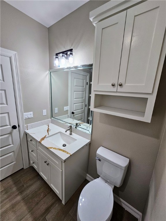 507 West Ragland Avenue Kingsville, TX 78363 - Photo 17 of 17 a bathroom with a toilet sink and mirror