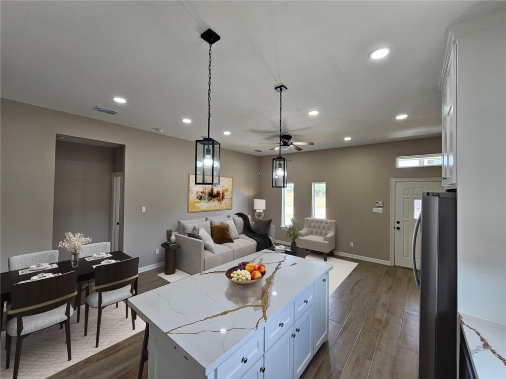 507 West Ragland Avenue Kingsville, TX 78363 - Photo 3 of 17 a living room with furniture and a chandelier