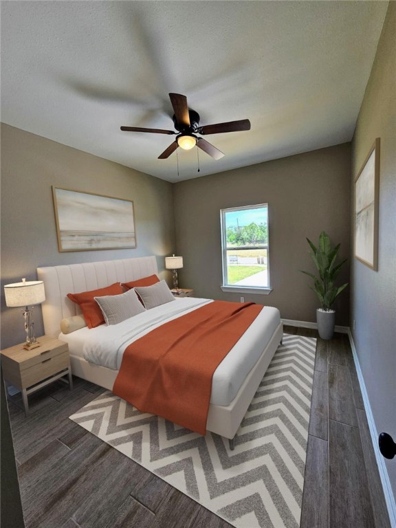 507 West Ragland Avenue Kingsville, TX 78363 - Photo 5 of 17 a bedroom with beds and a chandelier