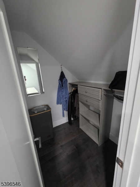 569 Harvard Avenue, Unit 1 Hillside, NJ 07205 - Photo 11 of 18 a view of walk in closet with clothes and shoes