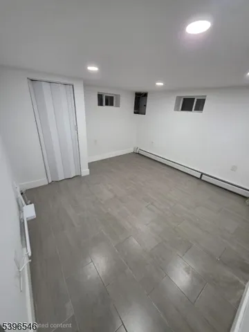 a view of a livingroom with furniture and cabinet