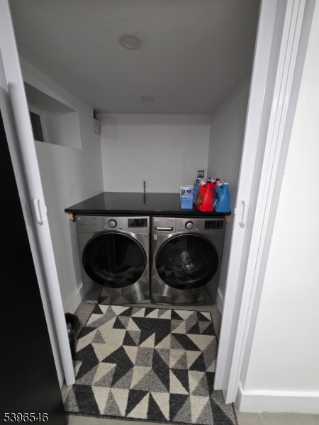 569 Harvard Avenue, Unit 1 Hillside, NJ 07205 - Photo 18 of 18 a utility room with dryer and washer