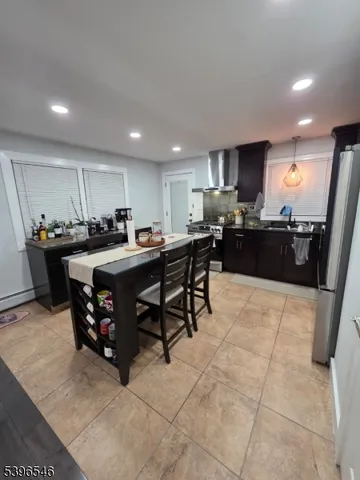a kitchen with stainless steel appliances granite countertop a sink counter space and cabinets
