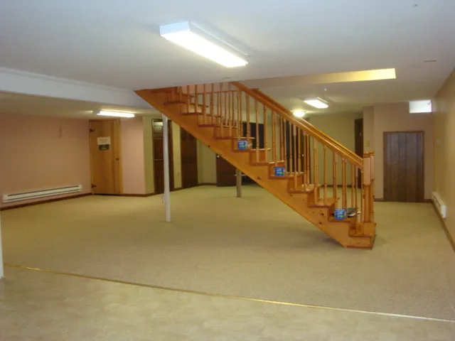 an empty room with closet area