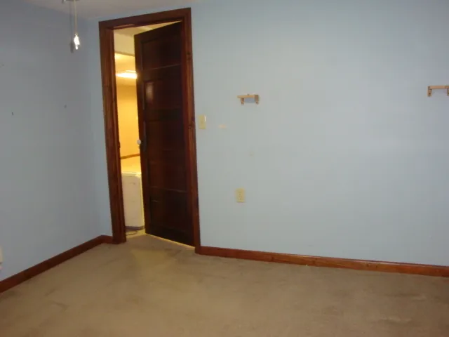 a view of an empty room with stairs