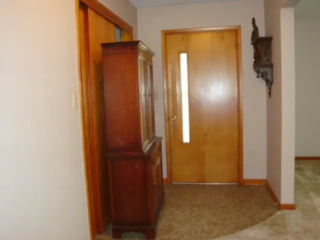 a kitchen with a sink cabinets and window