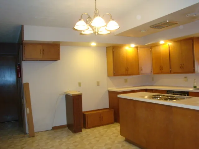 a kitchen with a sink and stove