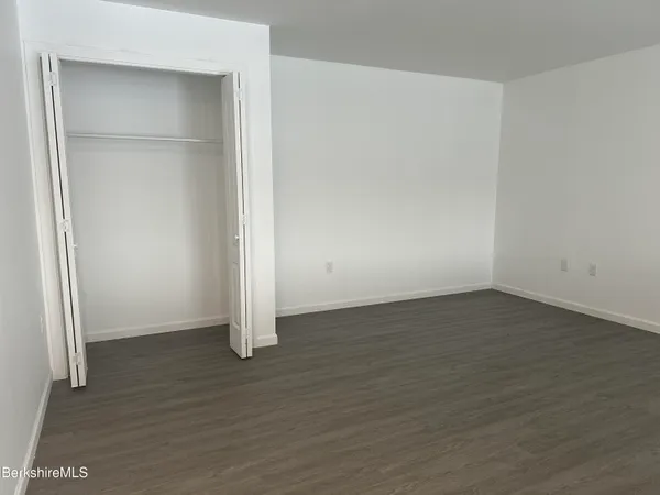 an empty room with wooden door