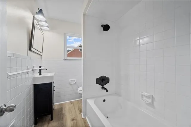a bathroom with a bathtub and a sink