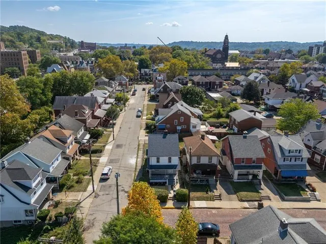 an aerial view of a building with parking
