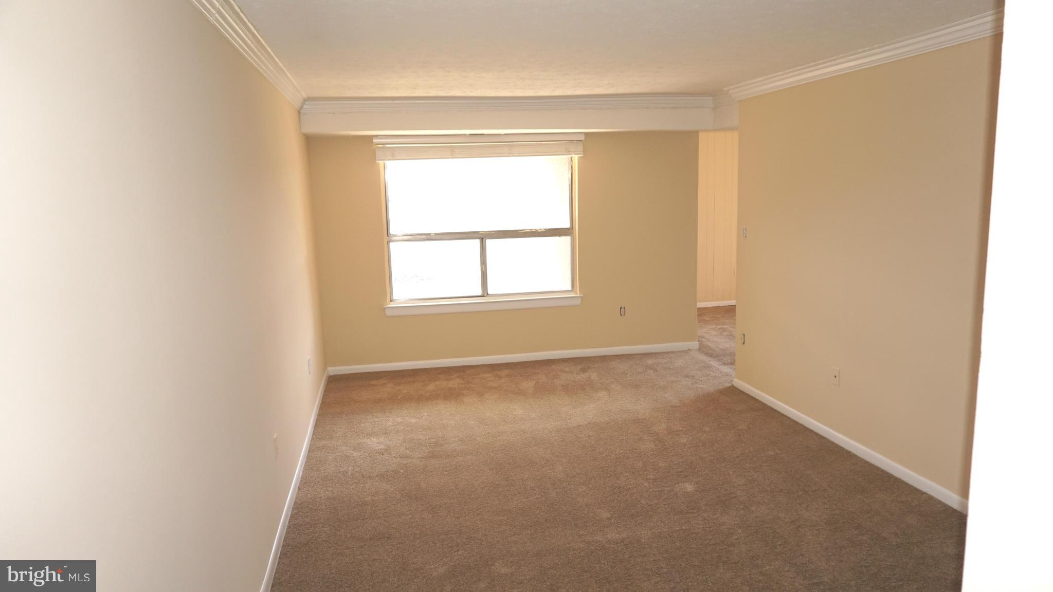 7923 Mandan Road, Unit 301 Greenbelt, MD 20770 - Photo 2 of 9 an empty room with a window