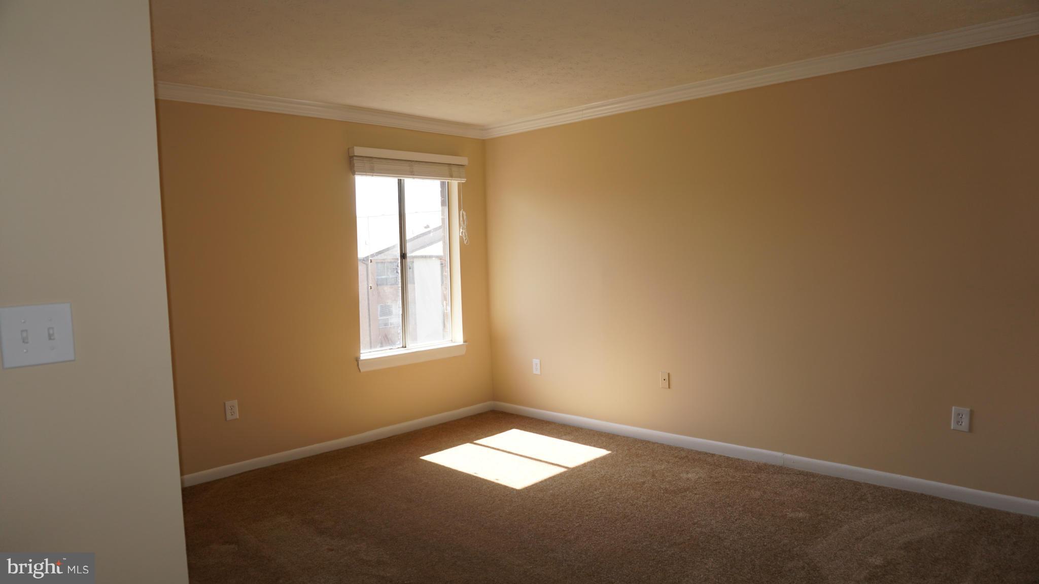 7923 Mandan Road, Unit 301 Greenbelt, MD 20770 - Photo 8 of 9 an empty room with a window