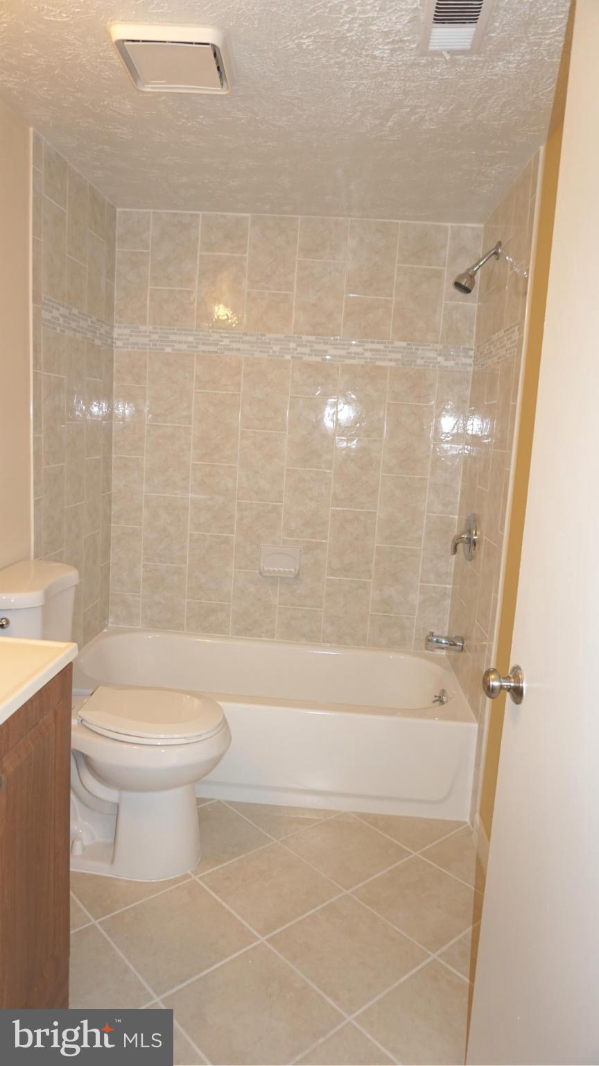 7923 Mandan Road, Unit 301 Greenbelt, MD 20770 - Photo 9 of 9 a bathroom with a toilet and a shower