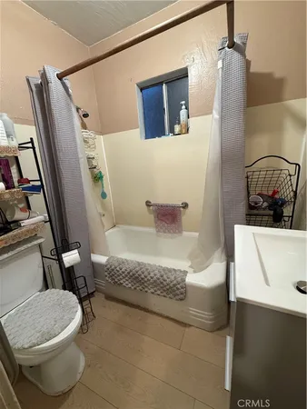 a bathroom with a sink a toilet and bathtub