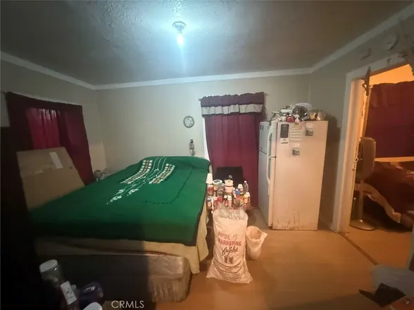 a green room with furniture and a flat screen tv