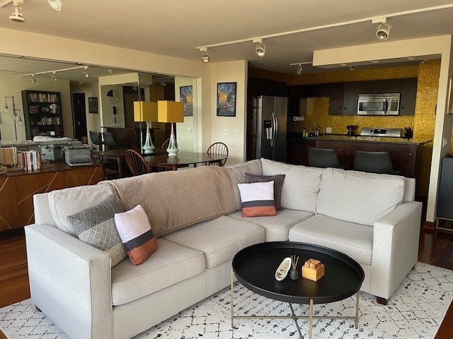 2800 North Lake Shore Drive, Unit 712 Chicago, IL 60657 - Photo 2 of 15 a living room with furniture and a wooden floor