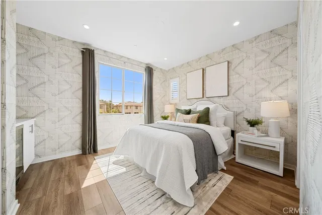 a bedroom with a bed and a night stand