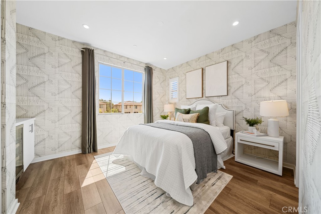 104 Coastal Garden Irvine, CA 92618 - Photo 16 of 43 a bedroom with a bed and a night stand