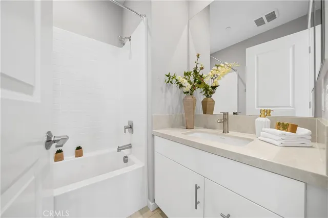 a bathroom with a sink a vanity and a mirror