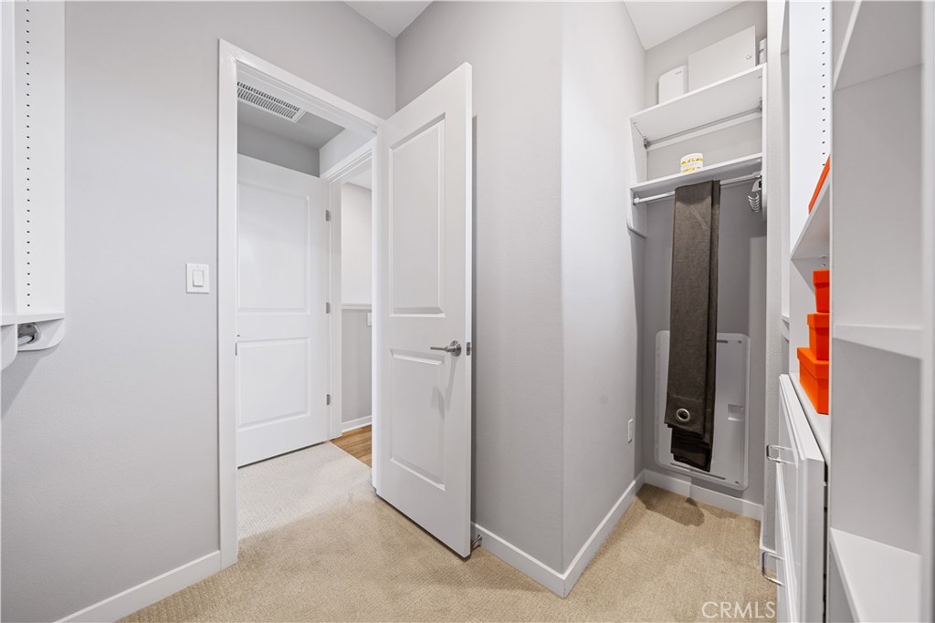 104 Coastal Garden Irvine, CA 92618 - Photo 28 of 43 a view of a walk in closet