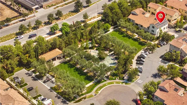 a aerial view of a house with a yard and garden